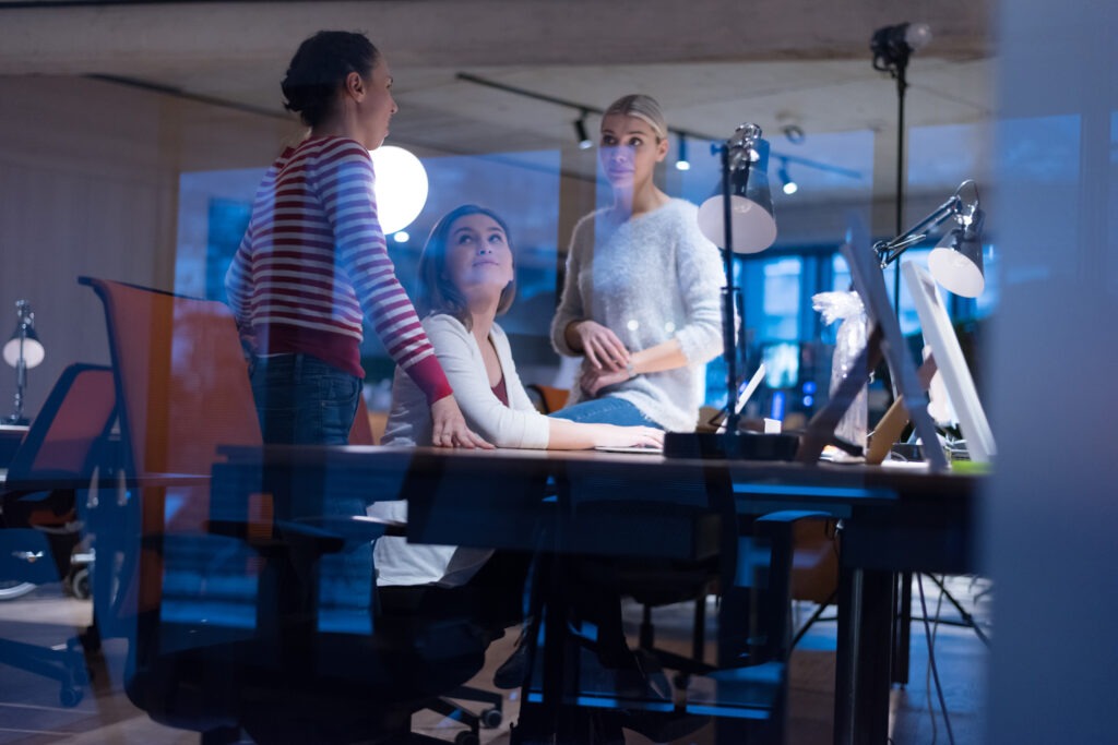 Meeting of co-workers and planning next steps of work. Young business group in discussion in their office. Startup people working in office.